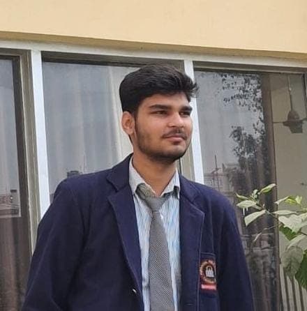 Alok Singh official profile photo in blazer and tie